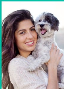 Smiling-women-holding-dog